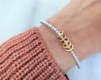 Sterling Silver Milestone Birthday Bracelet: Gold Rings for Each Decade