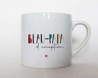 May include: White ceramic mug with a black and colorful design that says "BEAU-PAPA d'exception" with a small red heart at the bottom.