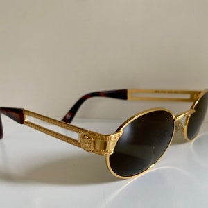 VERSACE lunettes de soleil vintage rare tête de lion en or noir