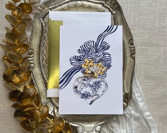 Tarjeta navideña con diseño de adorno navideño chinoiserie azul y blanco. Mensaje navideño para tarjeta de felicitación navideña con sobre con borde dorado.