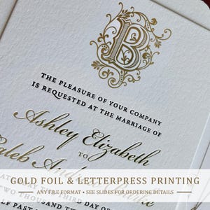 May include: A white wedding invitation card featuring a large gold foil letter B monogram with ornate flourishes. The text reads: The pleasure of your company is requested at the marriage of Ashley Elizabeth to Caleb Andrew Burke. The card has textured paper.