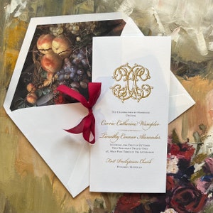 May include: A white wedding invitation with gold calligraphy announcing the marriage of Carrie Catherine Wampler and Timothy Connor Alexander. The ceremony will take place at First Presbyterian Church in Petoskey, Michigan on October 1st, 2022 at 3:30 PM.