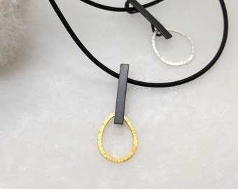 Ai-Ek, small handmade sterling silver pendant, black and white, black and gold
