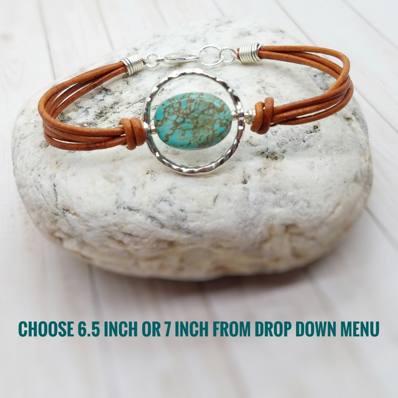 May include: A brown leather bracelet with a turquoise stone set in a silver circle. Choose 6.5 inch or 7 inch from the drop down menu.