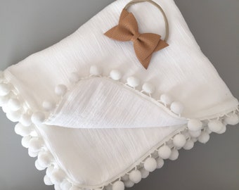pom pom swaddle blanket
