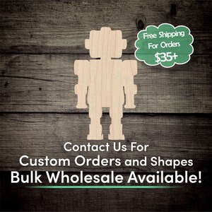 May include: Wooden cutout of a robot in the shape of a person. The robot is standing on a woodgrain background. The text "Contact Us For Custom Orders and Shapes Bulk Wholesale Available!" is below the robot. A green speech bubble with the text "Free Shipping For Orders $35+" is in the upper right corner of the image.