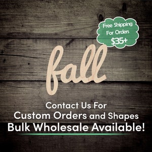 May include: Wooden cutout of the word "fall" in a cursive font. The cutout is on a brown wood background. The text "Free Shipping For Orders $35+" is in a white cloud shape with a green outline. The text "Contact Us For Custom Orders and Shapes Bulk Wholesale Available!" is below the cutout.