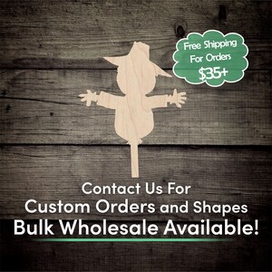 May include: Wooden cutout of a scarecrow with a hat, arms outstretched. The background is a rustic wood panel. Text reads: "Free Shipping For Orders $35+" and "Contact Us For Custom Orders and Shapes Bulk Wholesale Available!"