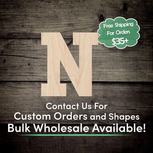 May include: A wooden letter N, painted in a light wood color, with a white border. The letter is on a wood background. The text "Contact Us For Custom Orders and Shapes Bulk Wholesale Available!" is below the letter. The text "Free Shipping For Orders $35+" is in a green speech bubble in the upper right corner of the image.