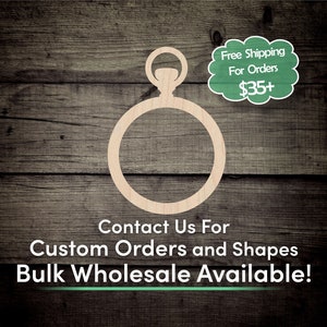 May include: A wooden cutout of a pocket watch with a ring around the face. The cutout is on a woodgrain background. The text "Contact Us For Custom Orders and Shapes Bulk Wholesale Available!" is below the cutout.