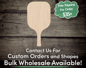 May include: A wooden paddle shaped like a pizza peel, with a long handle. The paddle is light brown and has a smooth surface. The text "Contact Us For Custom Orders and Shapes Bulk Wholesale Available!" is printed below the paddle.