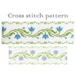 May include: Cross stitch pattern with a repeating design of blue flowers and green leaves. The pattern is shown in two different sizes.