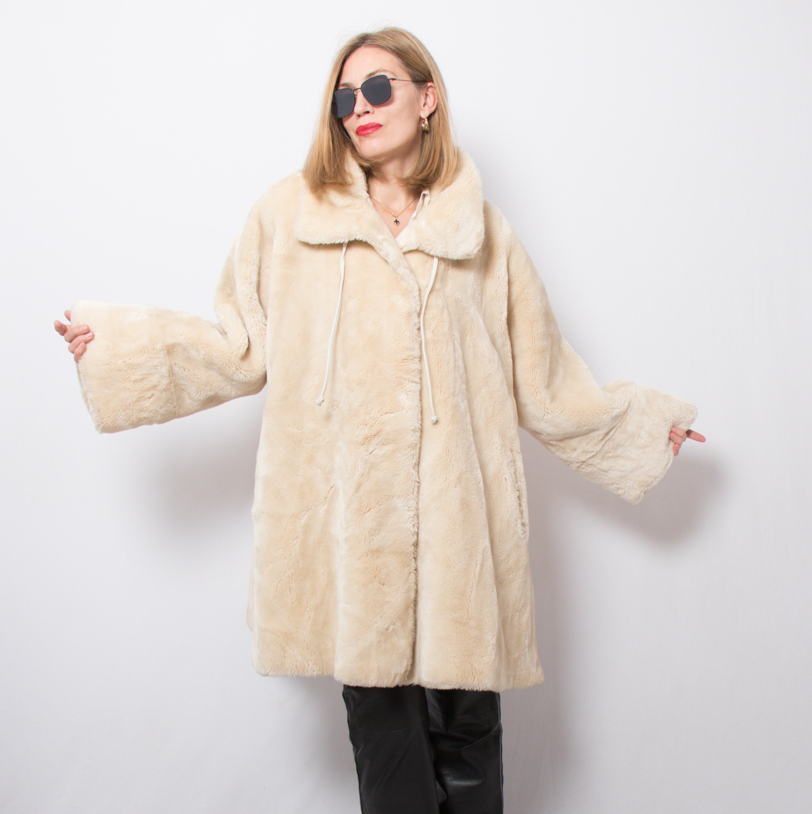 white fake fur coat
