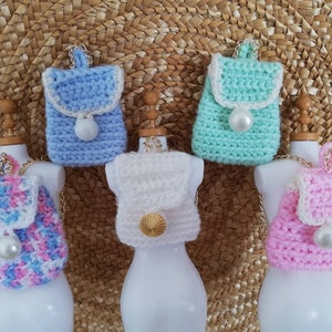 Doll bag backpack in different colors with pearls and gold decoration and chain strap in gold