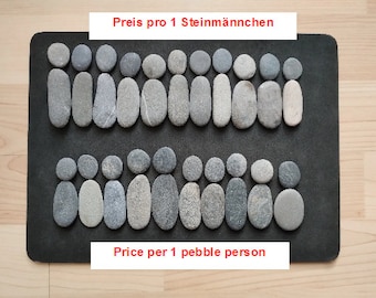 May include: Arrangement of gray pebbles on a dark surface, forming shapes resembling people. The text "Price per 1 pebble person" is displayed in red. The pebbles vary in size and shape, creating a unique, natural aesthetic.