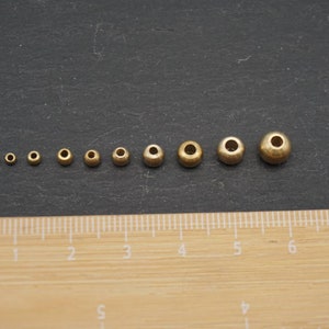 Perline in ottone 2,5 x 3 mm, rotonde, perline per gioielli, macramè e acchiappasogni immagine 4