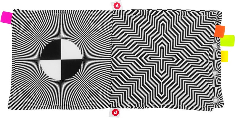 Puede incluir: Un libro de ilusiones &oacute;pticas en blanco y negro con un patr&oacute;n circular en un lado y un patr&oacute;n geom&eacute;trico en el otro.