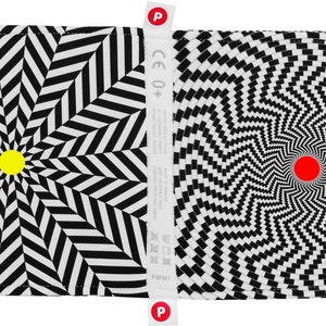 Puede incluir: Libro de ilusiones &oacute;pticas en blanco y negro con un c&iacute;rculo amarillo en un lado y un c&iacute;rculo rojo en el otro. El libro tiene una etiqueta CE 0+.