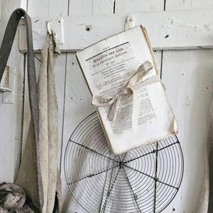 May include: A rustic wooden sign with the text "Welcome to our home" in a handwritten style. The sign is rectangular, with a distressed finish, and features a simple, inviting design. It's suitable for indoor or outdoor use.