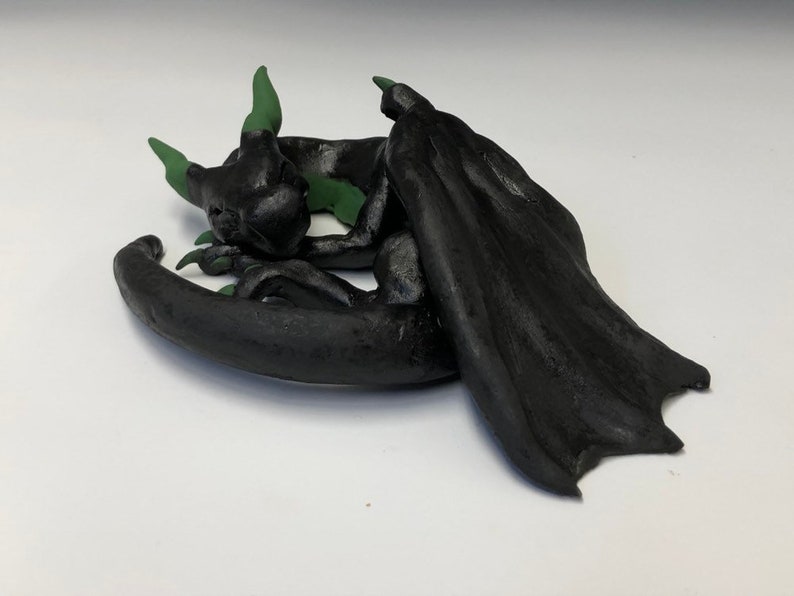 cute sleeping ceramic dragon figure M\u00e1vros