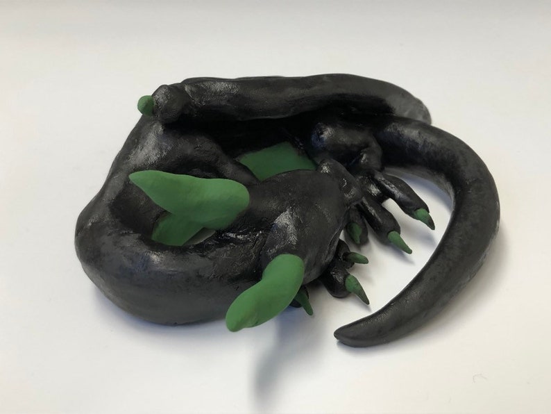 cute sleeping ceramic dragon figure M\u00e1vros