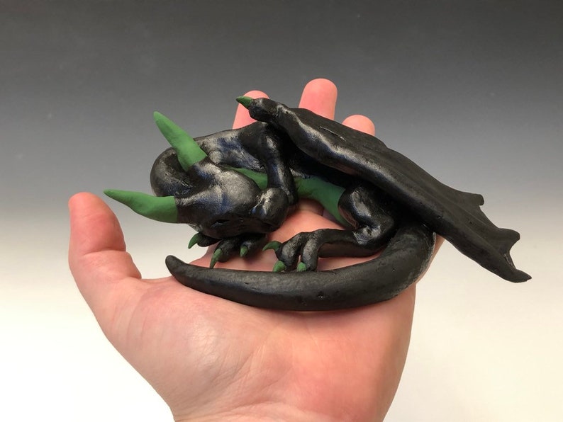 cute sleeping ceramic dragon figure M\u00e1vros