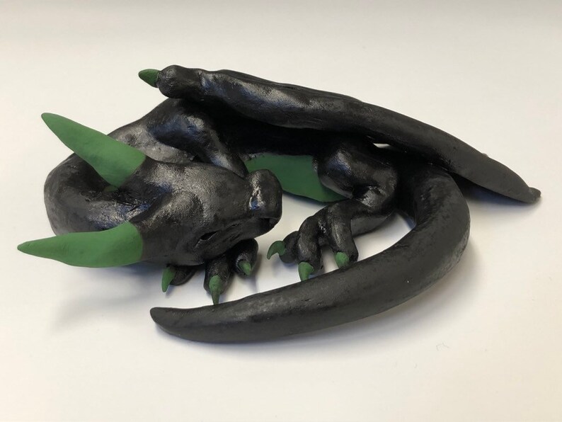 cute sleeping ceramic dragon figure M\u00e1vros