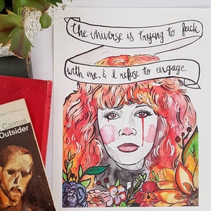 May include: Watercolor illustration of a woman with red hair and tears, surrounded by flowers. A banner above the woman reads, "The universe is trying to fuck with me, & I refuse to engage."