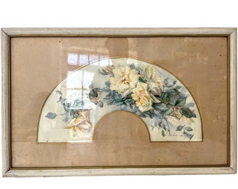 May include: A framed watercolor painting of a fan-shaped arrangement of white roses with green leaves. The painting is signed "L. Sullivan" in the lower right corner.