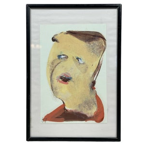 Peut inclure: Une peinture abstraite encadrée d'un visage avec un schéma de couleurs jaune, orange et rouge. La peinture est dans un cadre noir.