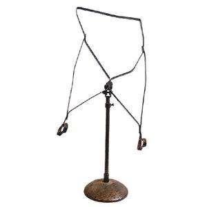 May include: A black metal stand with a round base and a tall, adjustable post. The stand has a wire frame with two rings attached to it.