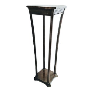 May include: A dark brown wooden plant stand with a square top and curved legs. The stand has a simple design and is made of solid wood.