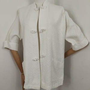 1950s White embossed Tea timer jacket
