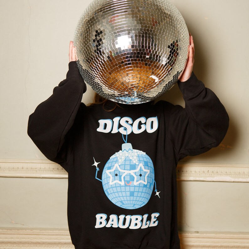 May include: A black sweatshirt with a blue disco ball ornament graphic and the text "DISCO BAUBLE".