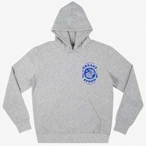 May include: A gray hooded sweatshirt with a blue logo that says "Greasy Spoon" and features a plate with a fork and knife, a steaming bowl of food, and a spoon.