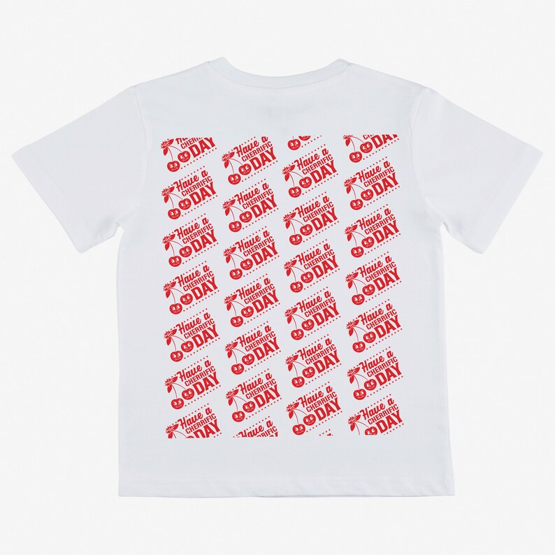 May include: White t-shirt with a red repeated pattern of cherries and the text "Have a Cherrific Day".