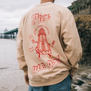 Pier We Go Men&#39;s Slogan Sweatshirt with Funfair Graphic