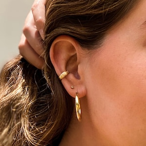 Boucle d'oreille florale en or gold filled 14 carats