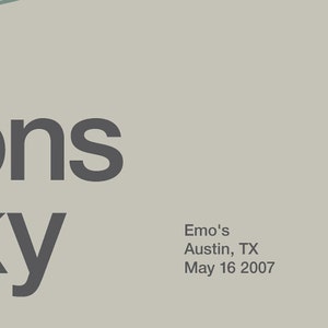 May include: Black and white text on a light gray background. The text reads "Emo's Austin, TX May 16 2007".