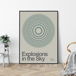 May include: A black framed poster with a light green concentric circle design. The text "Explosions in the Sky" is below the circle. The text "Emo's Austin, TX May 10, 2007" is in the bottom right corner.