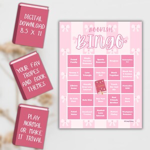 May include: A pink "Bookish Bingo" game board with a grid of book-related themes, surrounded by pink bows. Three pink book-shaped cards with text: "Digital Download 8.5 X 11", "Your Fav Tropes and Book Themes", and "Play Normal or Make it Trival".