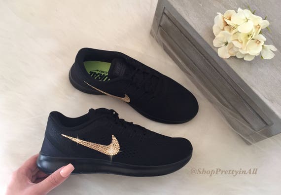 black nike shoes with rose gold swoosh