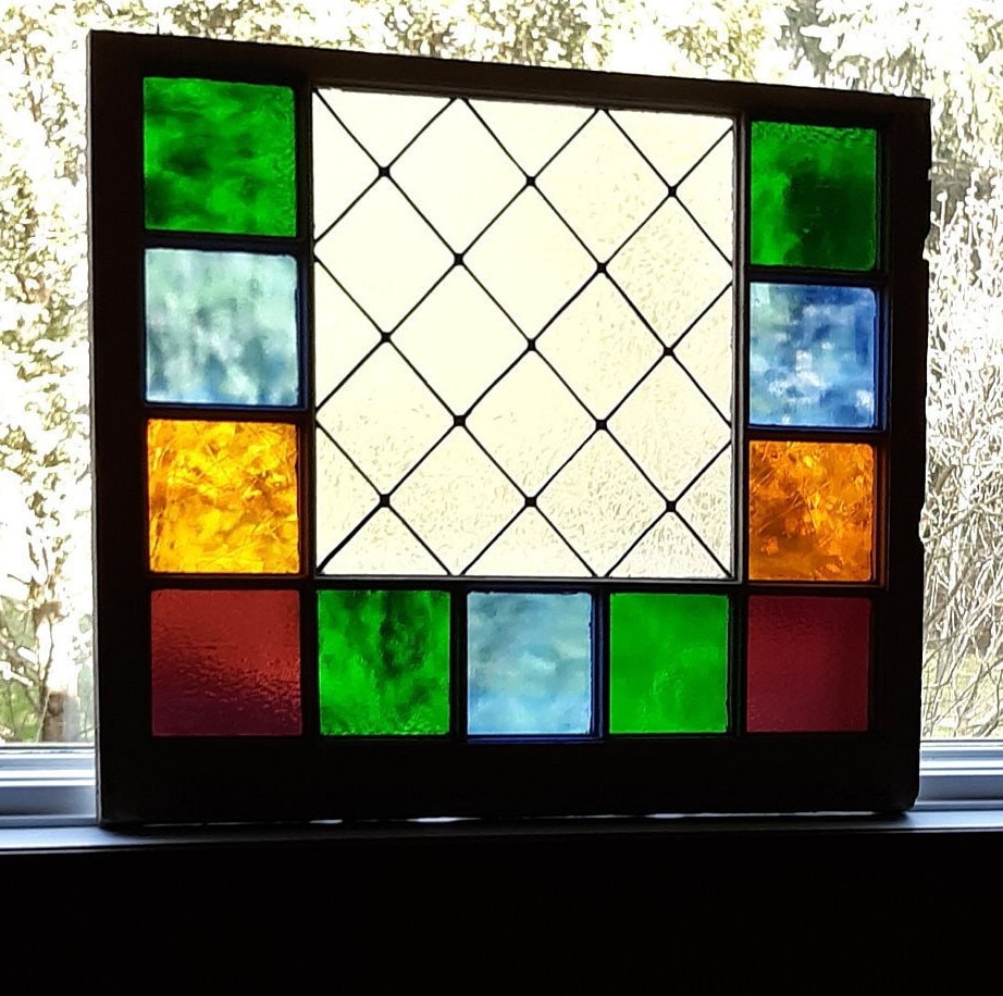 Stained glass in old window frame