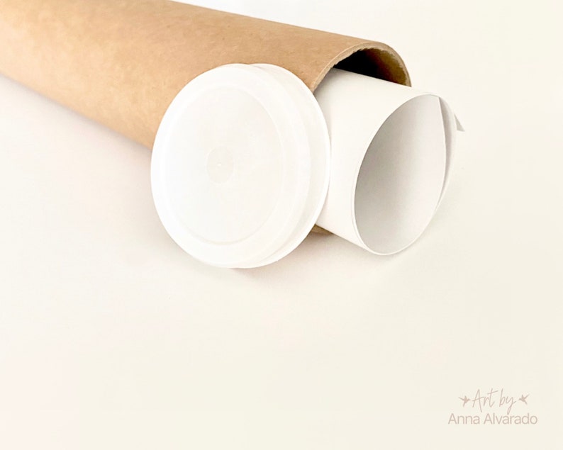 May include: A white print is rolled inside a brown cardboard tube, with a white plastic cap beside it. The image is set against a light cream background. The text "Art by Anna Alvarado" is in the bottom right corner.
