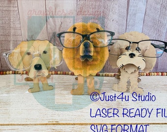 May include: Three wooden dog figurines wearing glasses. The dogs are a golden retriever, a chow chow, and a poodle. The glasses are clear and black. The figurines are standing on a wooden surface.  @Just4u Studio LASER READY FILE SVG FORMAT