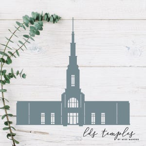 May include: A gray silhouette of a temple with a tall spire, windows, and a rectangular base. The text "lds temples" is written in cursive at the bottom, with "by miss mandee" below it. Eucalyptus branches are in the upper left corner.