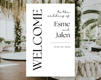 May include: A white welcome sign with black text that reads "Welcome to the wedding of Esme and Jalen June 20, 2024".