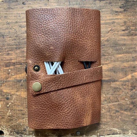 Top-grain leather, actually made in Maine USA — rare 'genuinely local craft' provenance in a category drowning in overseas dropship listings.