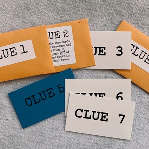 May include: Seven brown and blue envelopes and cards with the text "Clue" and a number from 1 to 7. The envelopes are brown and the cards are white and blue.