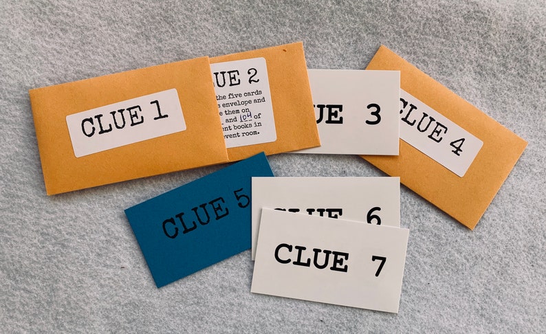 May include: Seven brown and blue envelopes and cards with the text "Clue" and a number from 1 to 7. The envelopes are brown and the cards are white and blue.